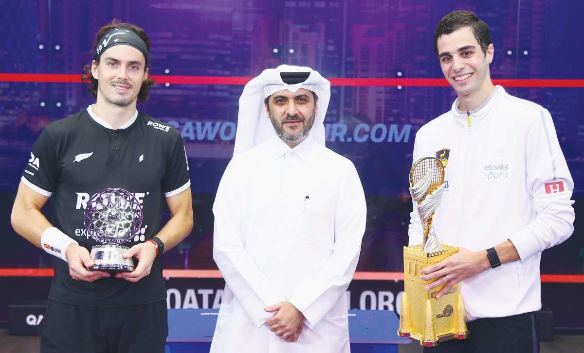 Champion Ali Farag and runner-up, New Zealand’s Paul Coll are seen with Tareq Zainal.