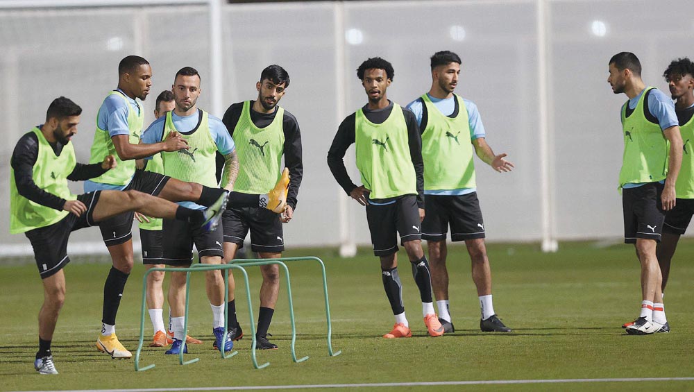 Al Sadd's players in action during a pre-match training session yesterday.