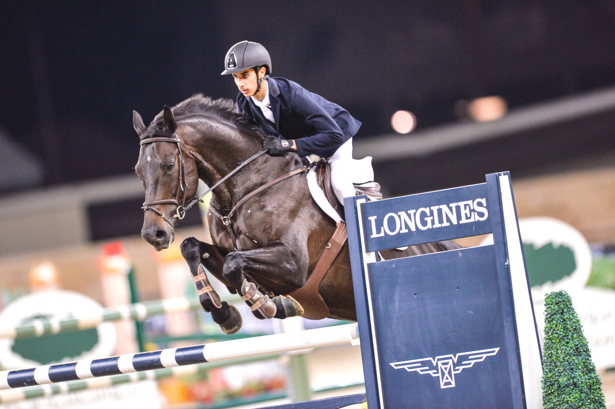 Faris Saad Al Qahtani guides Hidiene qover a hurdle during the medium Tour Individual Event of the seventh Round of the Longines Hathab Qatar Equestrian Tour at Al Shaqab Indoor Arena yesterday.