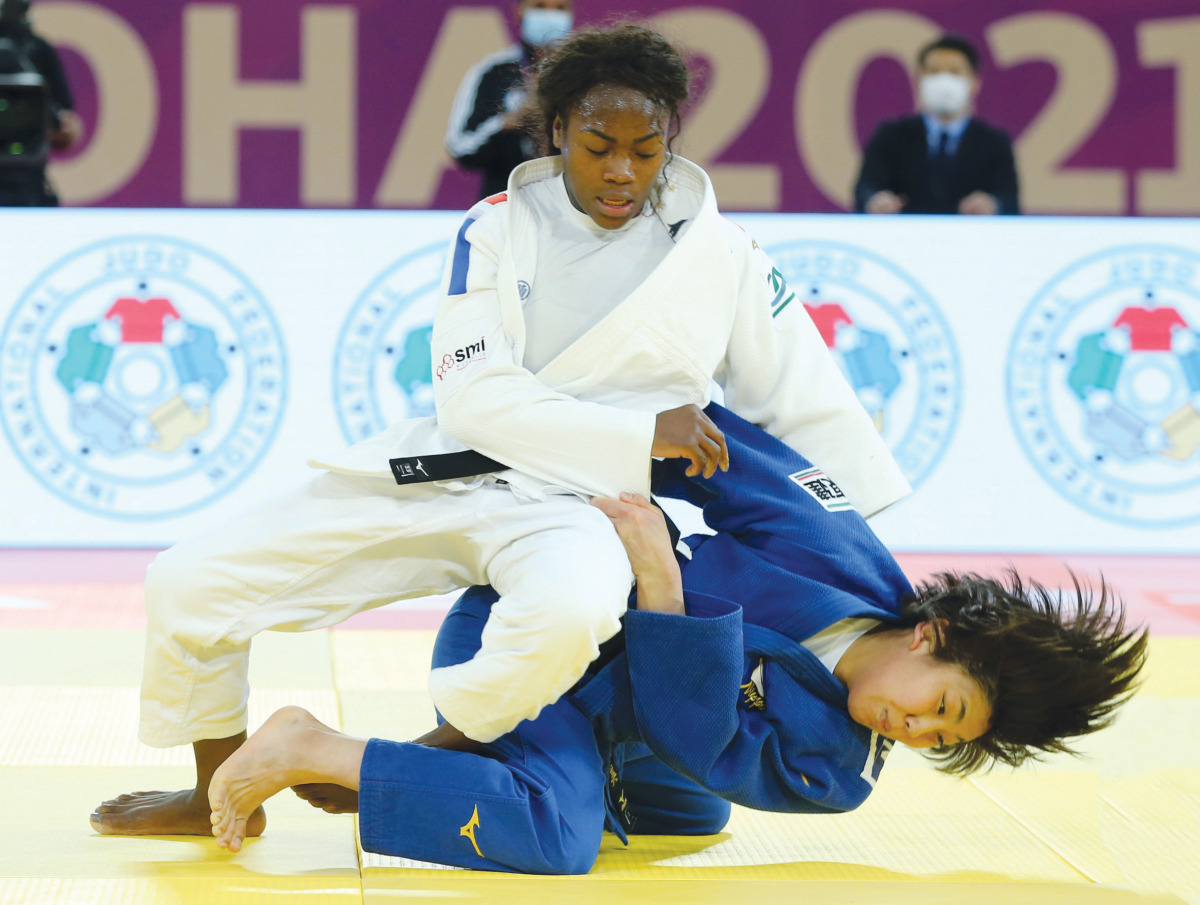 Clarisse Agbegnenou (in white) competes with Nami Nabekura  during their women's under 63 final yesterday. PICTURES: IJF