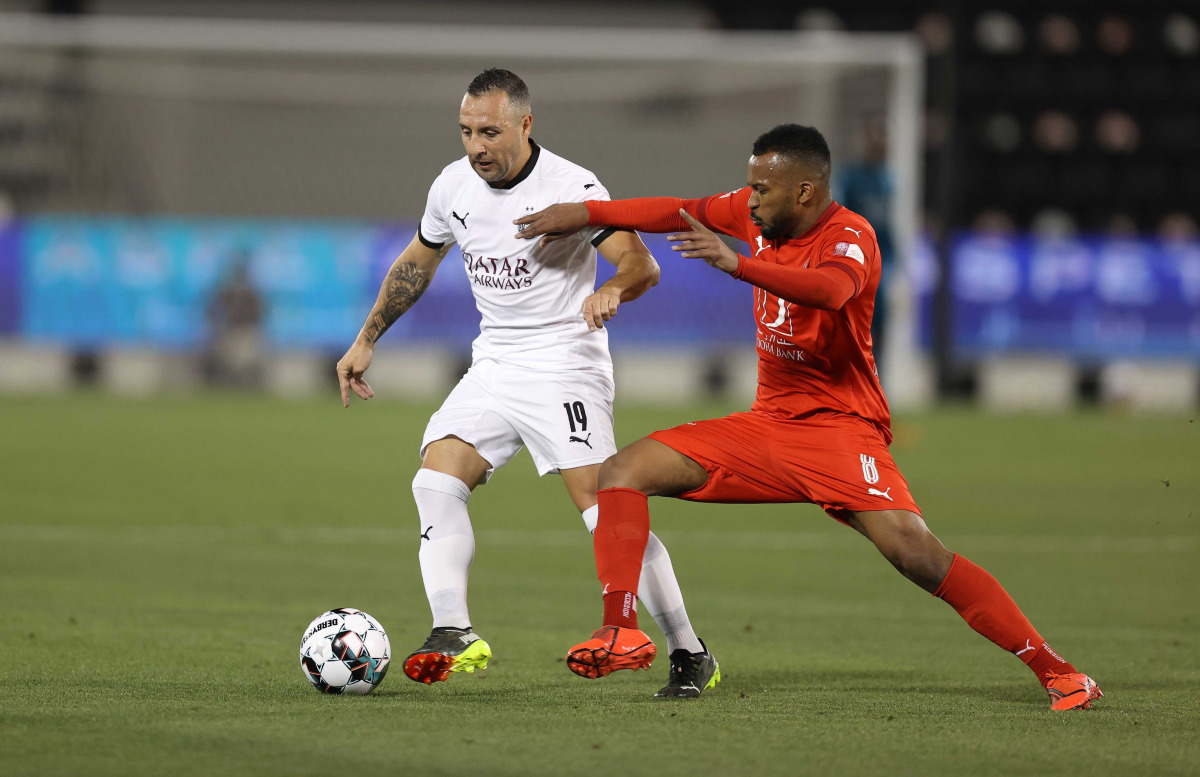 Al Sadd's Samtiago Cazorla and Ahmed Fathi Abdoulla vie for the ball during their QNB Stars League match played at Al Sadd Stadium yesterday.