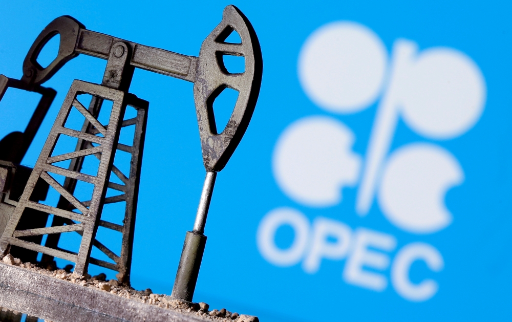 File photo: A 3D-printed oil pump jack is seen in front of displayed OPEC logo in this illustration picture, April 14, 2020. Reuters/Dado Ruvic/File Photo