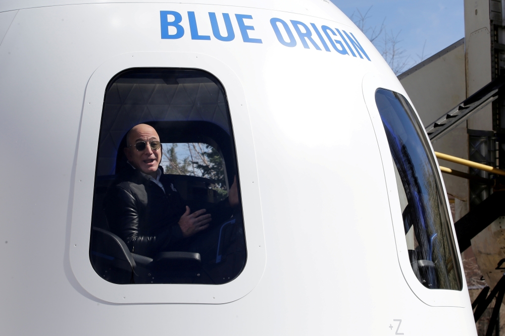 File photo: Amazon and Blue Origin founder Jeff Bezos addresses the media about the New Shepard rocket booster and Crew Capsule mockup at the 33rd Space Symposium in Colorado Springs, Colorado, United States April 5, 2017. Reuters/Isaiah J. Downing/File P