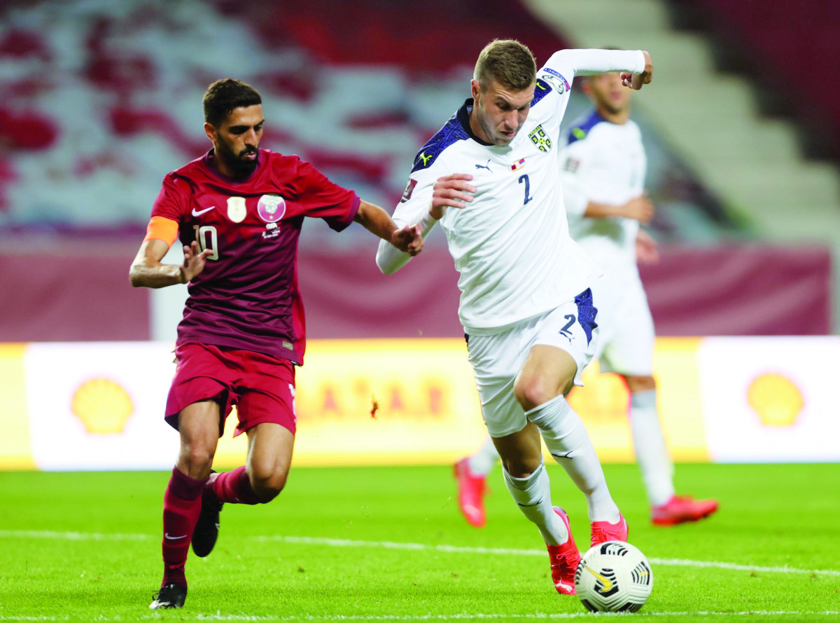 Qatar's Hassan Al Haydos vies for the ball possession  with Strahinja Pavlovic of Serbia during their European Qualifier played at the Nagyerdei Stadion in Debrecen, Hungary yesterday. Pic: QFA