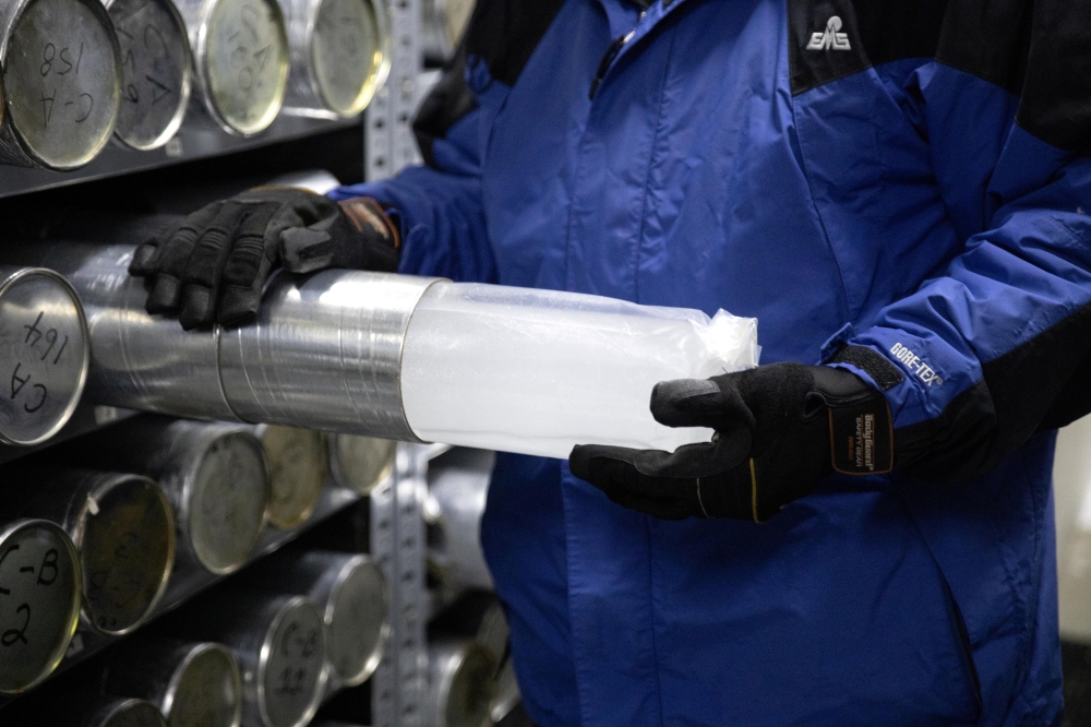 Lonnie Thompson, professor and research scientist at The Ohio State University, holds an ice core sample from a glacier in the Byrd Polar and Climate Research Center in Columbus, Ohio, U.S., January 15, 2021. The Byrd Polar and Climate Research Center gat