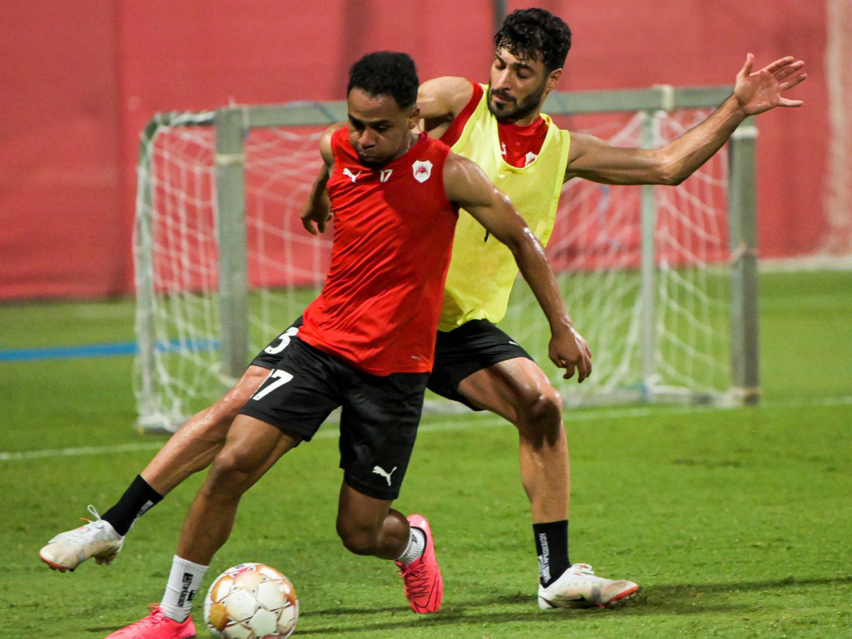 Al Rayyan players in action during a practice session yesterday.