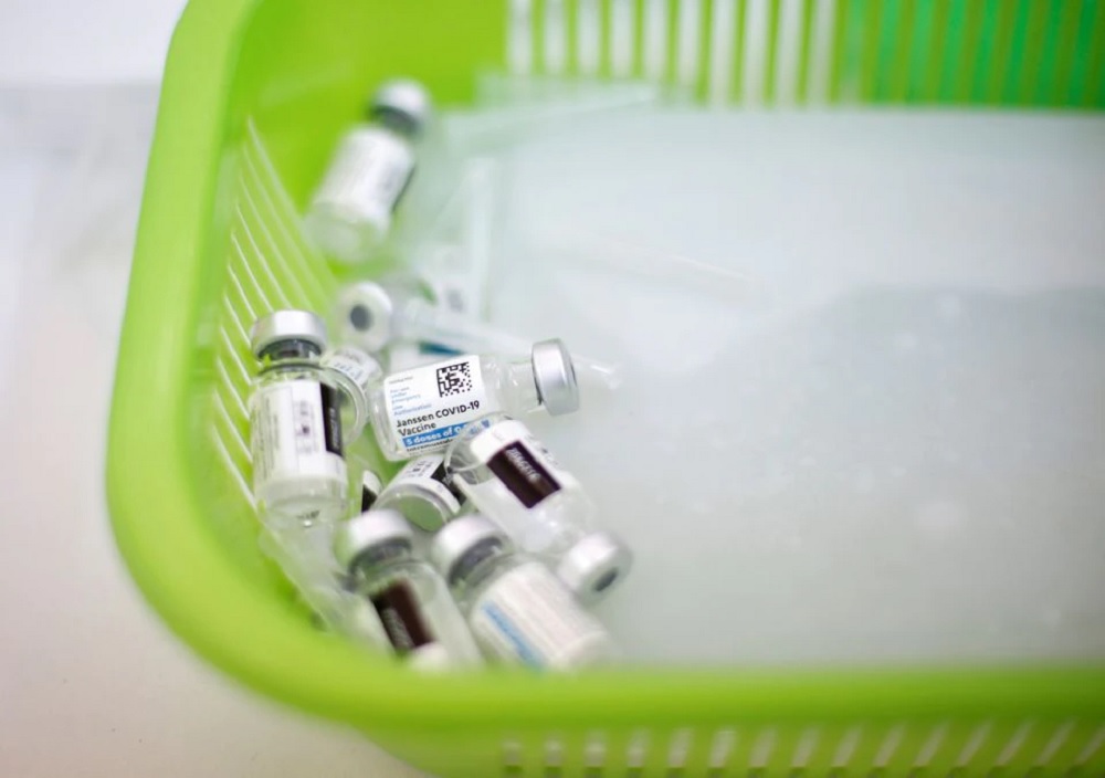 Empty vials of the Janssen vaccine against the coronavirus disease (COVID-19) are seen in a basket at a Mi Teleferico cable car station turned into a vaccination centre, in El Alto, Bolivia July 25, 2021. REUTERS/Manuel Claure

