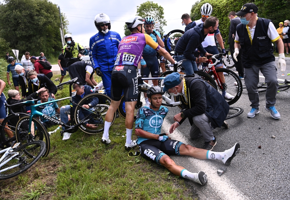 June 26, 2021 B&B Hotels p/b KTM rider Cyril Lemoine of France receives medical attention Pool via REUTERS/Anne-Christine Poujoulat/File Photo