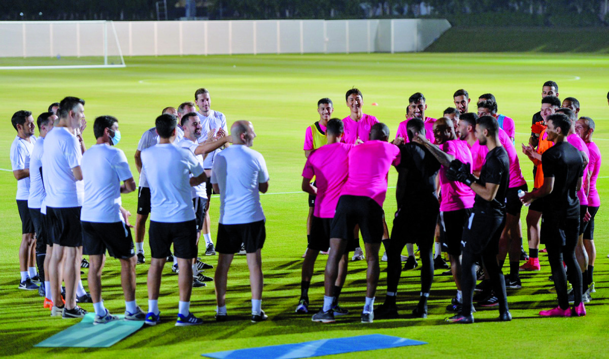 Coach Xavi Hernandez speaks to Al Sadd players and officials during a training session yesterday. Pic: Twitter/ @AlSaddSC