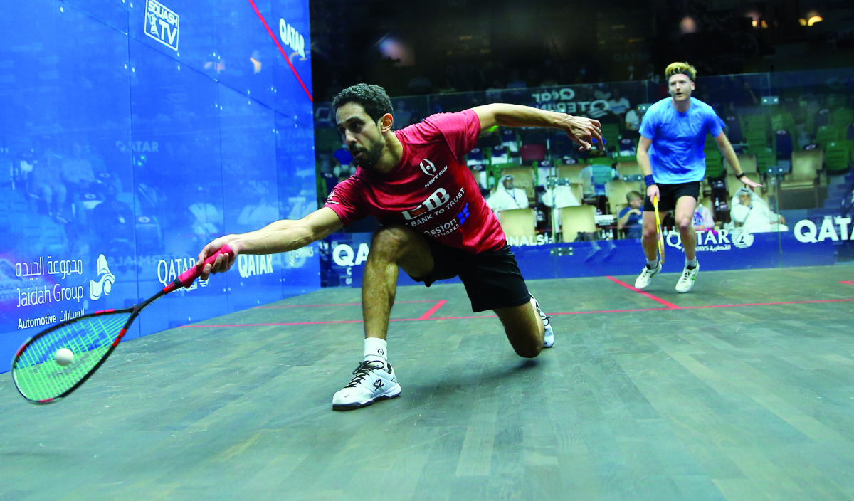 Egypt's Tarek Momen (left) in action against England's Tom Richards during their third round clash, yesterday.