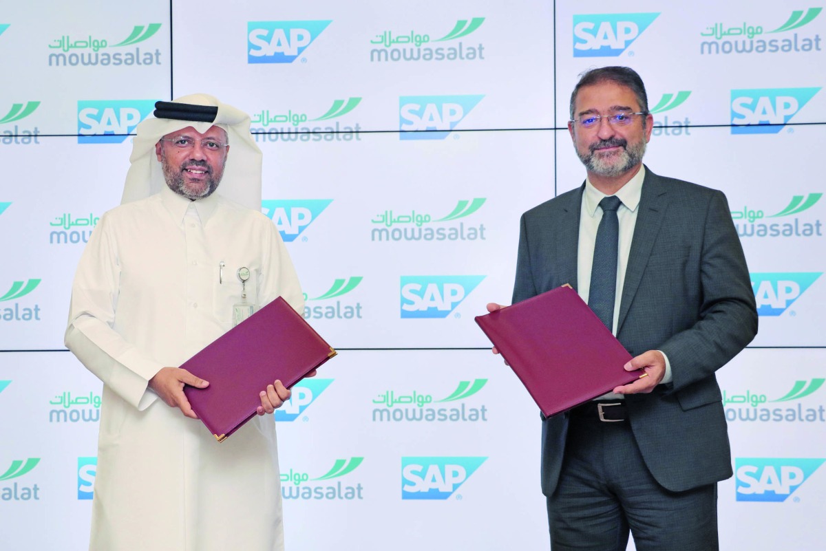 Mowasalat (Karwa) CAO Ahmed Al Muftah (left); and Mazen Raad, Chief Innovation Officer, SAP Middle East South, exchanging documents after signing the MoU.