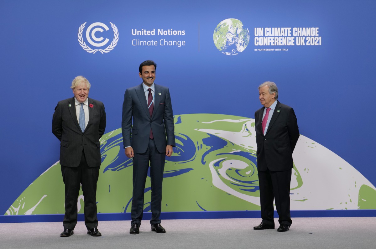 Amir H H Sheikh Tamim bin Hamad Al Thani with UN Secretary-General H E Antonio Guterres and the Prime Minister of the United Kingdom H E Boris Johnson, during the opening session of the 26th United Nations Climate Change Conference, in Glasgow, Scotland, yesterday.