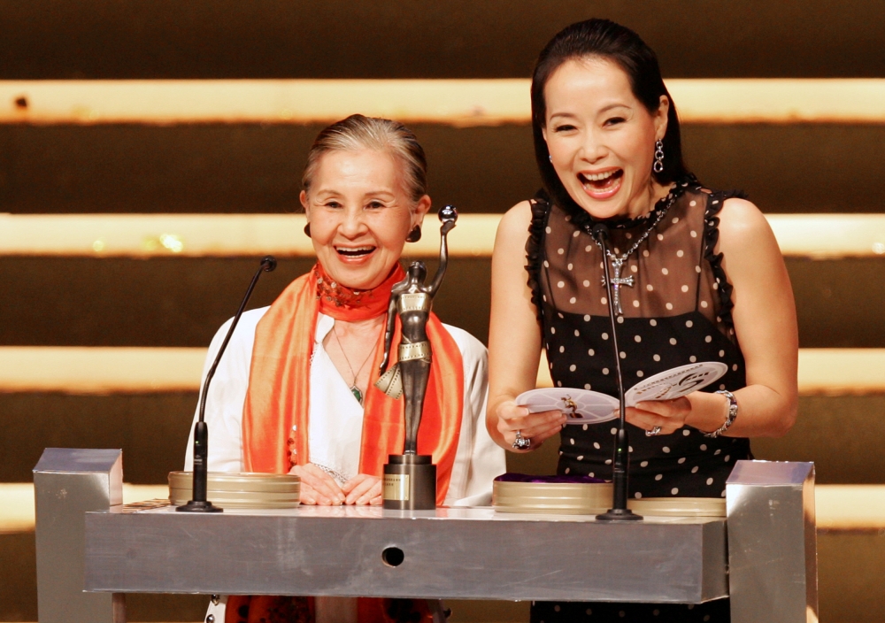 Japanese Oscar-winning movie costume designer Emi Wada (L) and Hong Kong actress Cecilia Yip present an award at the 25th Hong Kong Film Awards, April 8, 2006. REUTERS/Paul Yeung/File Photo