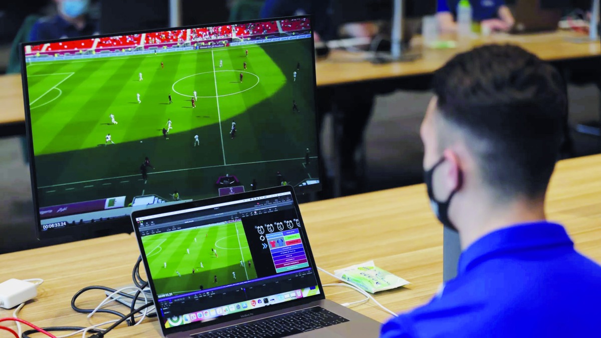 An official analyses a game during the FIFA Arab Cup.