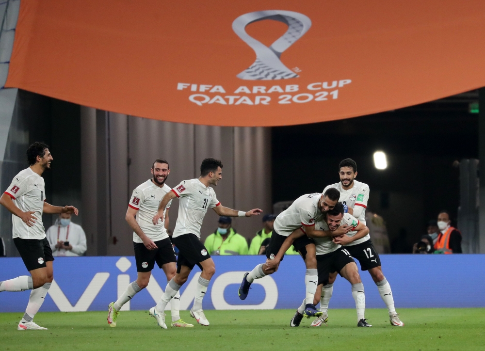 December 4, 2021 Egypt's El Wensh celebrates scoring their third goal with teammates REUTERS/Suhaib Salem