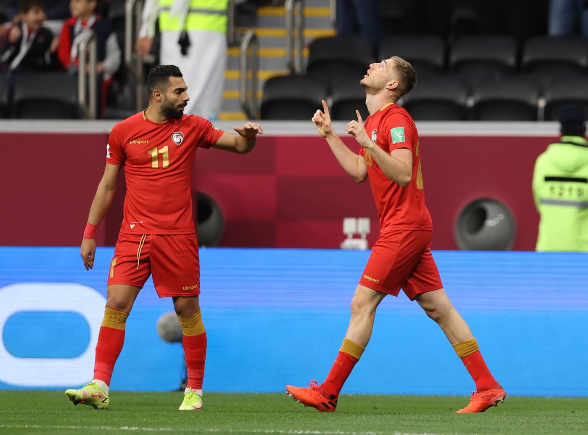 Syria’s Oliver Kass Kawo celebrates scoring their first goal against Tunisia at Al Bayt Stadium.