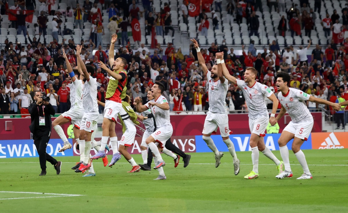 Tunisia players celebrate after the match.