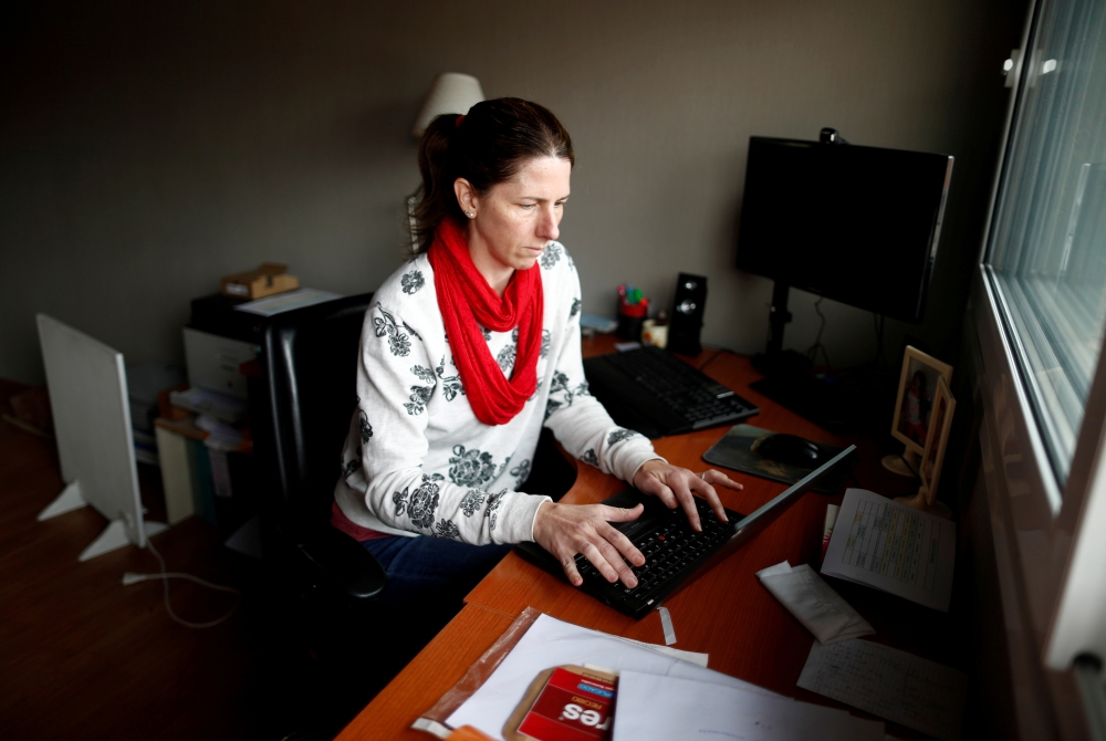 Barbara Temperley, 42, works from her home office, in Buenos Aires, Argentina September 6, 2021. REUTERS/Agustin Marcarian/File Photo