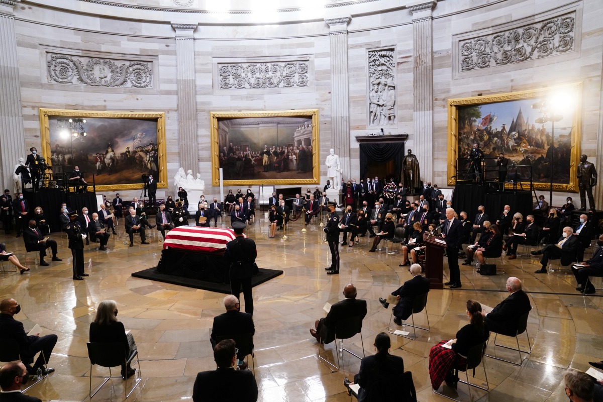 U.S. President Joe Biden speaks near the casket of former U.S. Senator Bob Dole during a ceremony preceding his lying in state in the Rotunda of the U.S. Capitol in Washington, D.C., U.S., December 9, 2021. Shawn Thew/Pool via REUTERS
