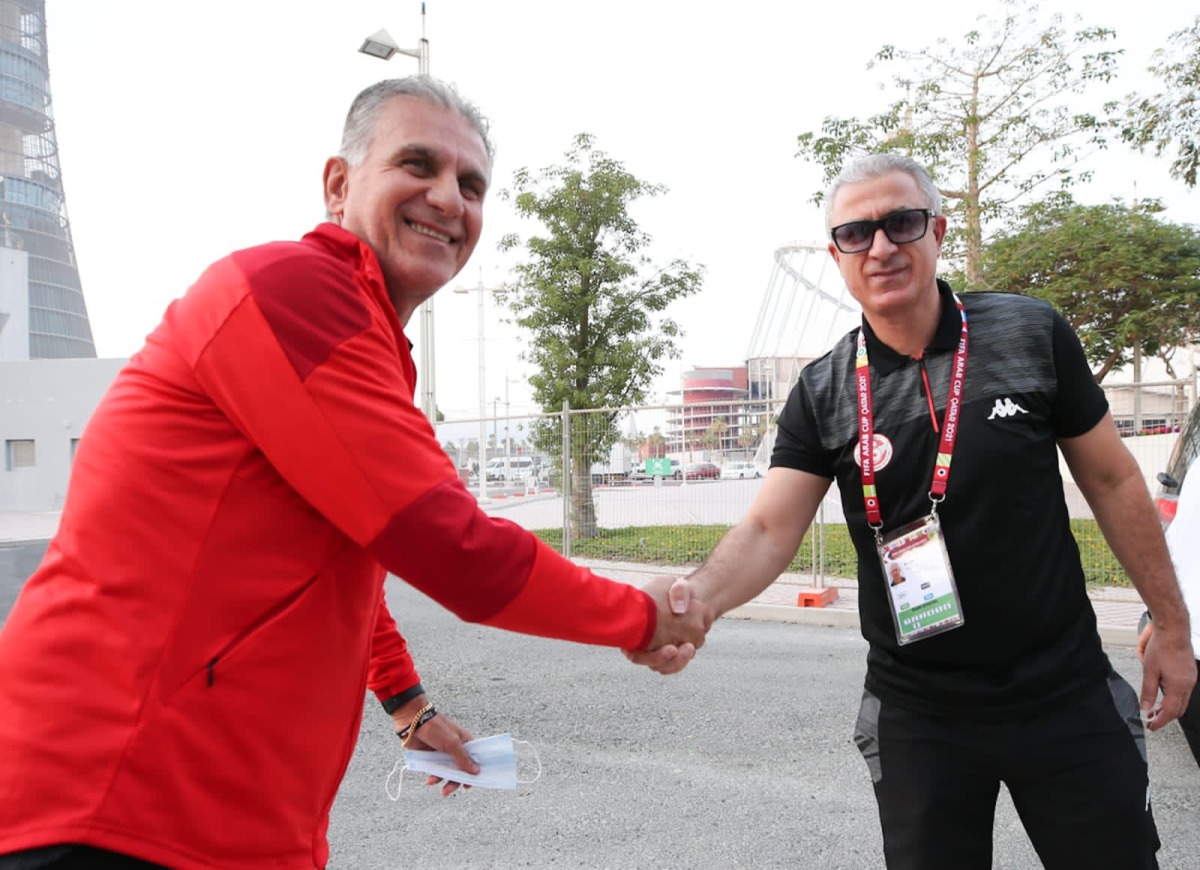 Egypt coach Carlos Queiroz (left) shakes hands with Tunisia coach Mondher El Kabir after a press conference yesterday.