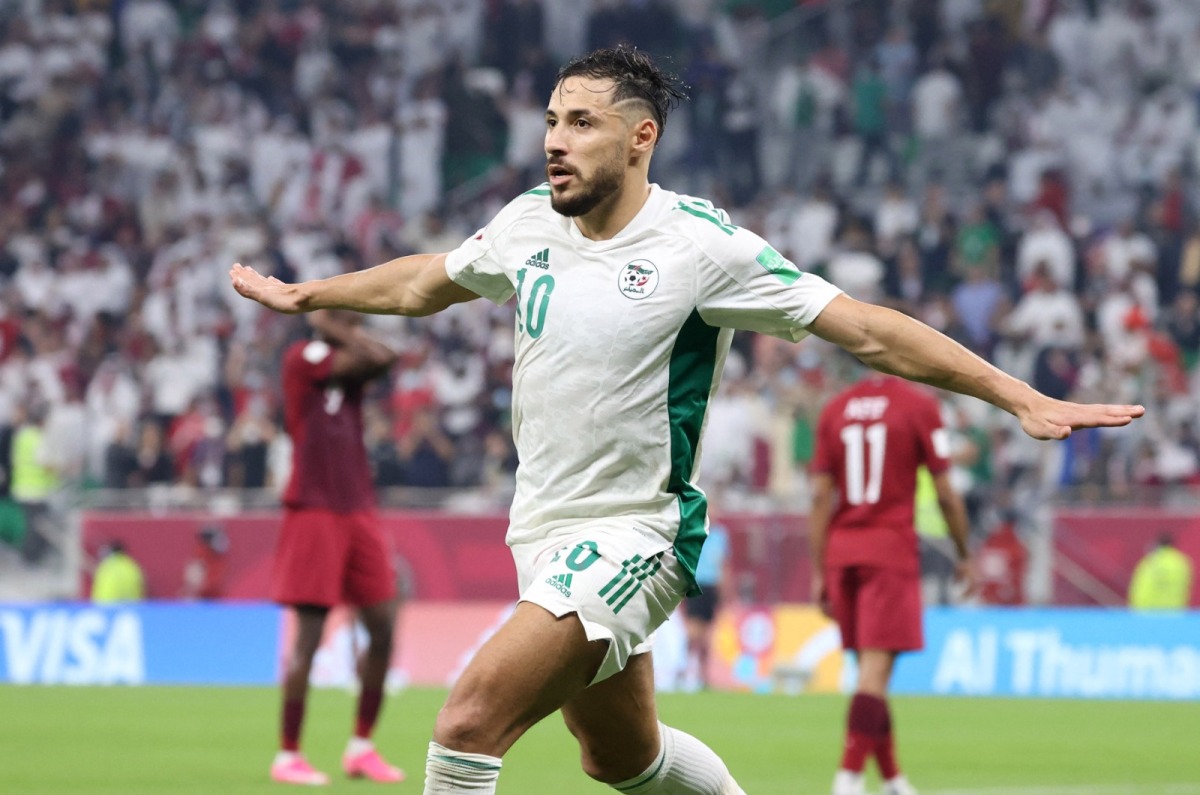 Algeria's Mohammed Belaili celebrates after scoring their second goal against Qatar.