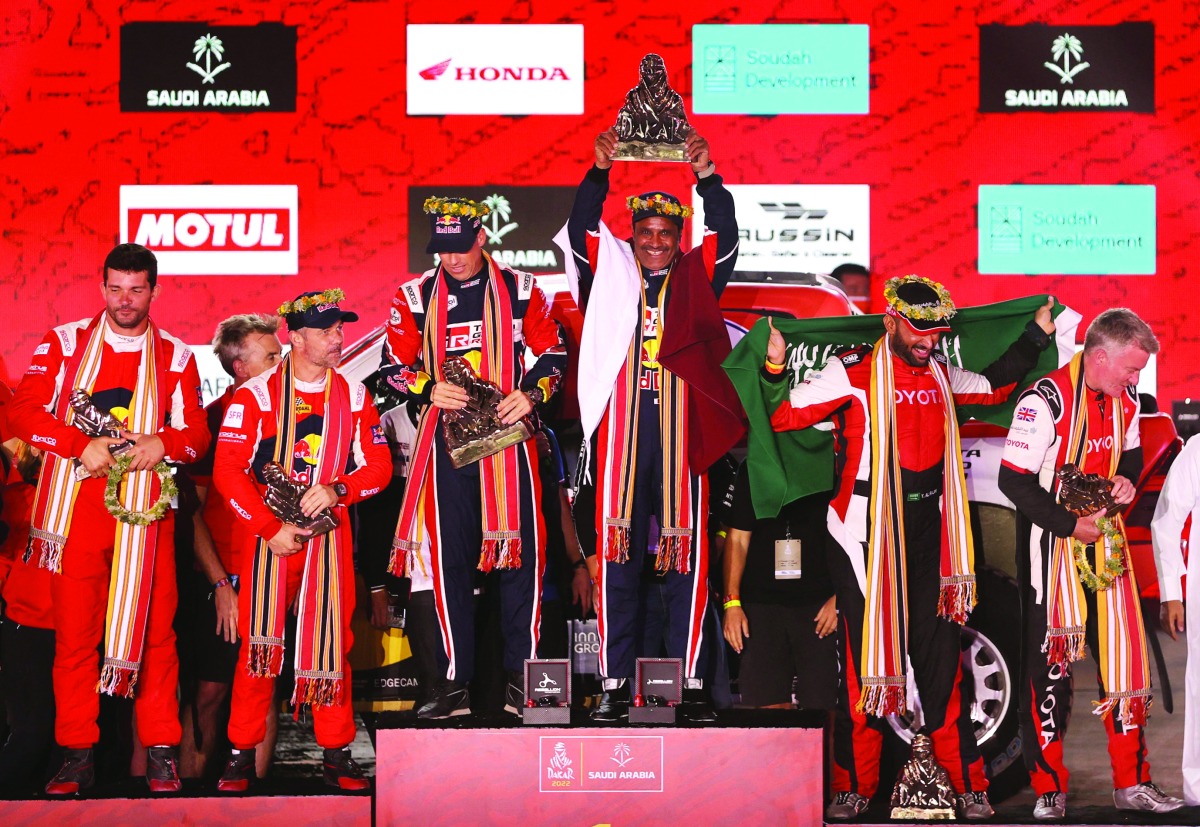 Toyota Gazoo Racing’s Nasser Saleh Al Attiyah and co-driver Matthieu Baumel celebrate with the trophies on the podium after winning the T1 Overall Classification alongside Bahrain Raid Xtreme’s Sebastien Loeb and co-driver Fabian Lurquin (second) and Overdrive Toyota’s Yazeed Al Rajhi and co-driver Michael Orr (third).