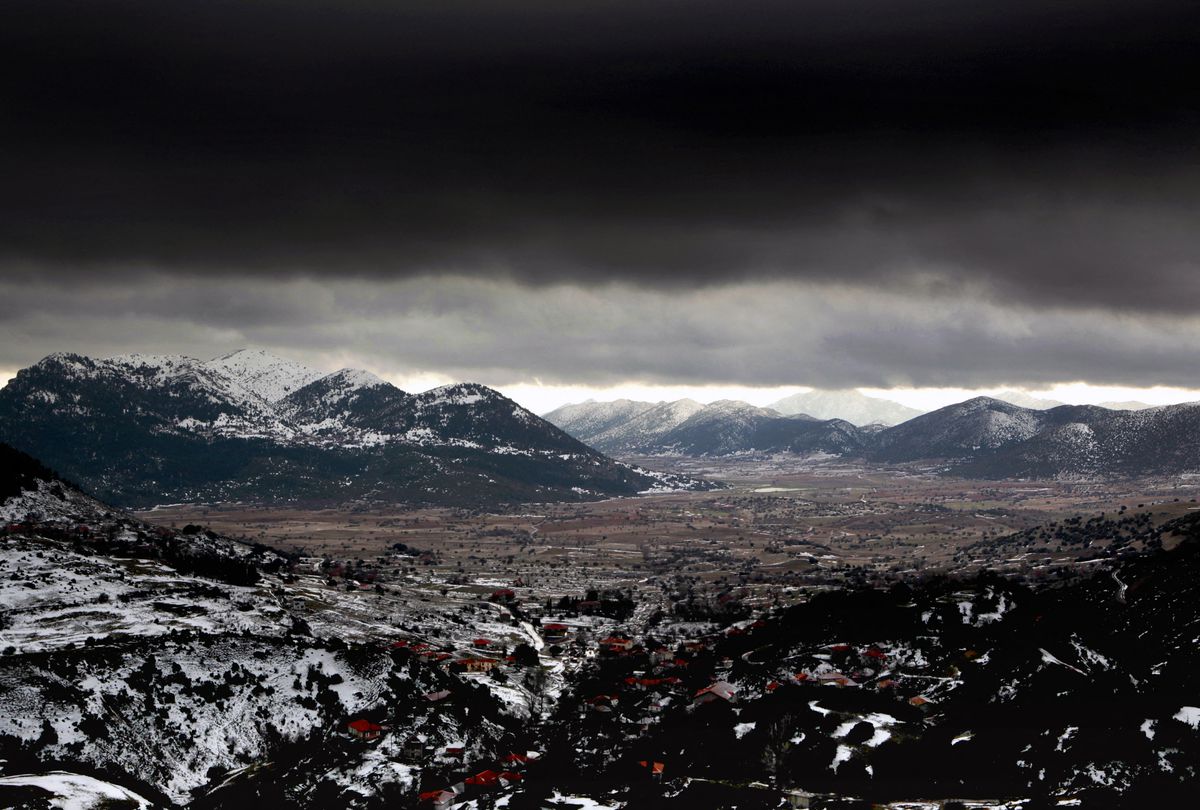 A storm approaches the snow covered mountain range of Panachaiko, near Kalavryta, some 200 km (124 miles) south-west of Athens in Peloponnese district February 29, 2012. REUTERS/Yannis Behrakis

