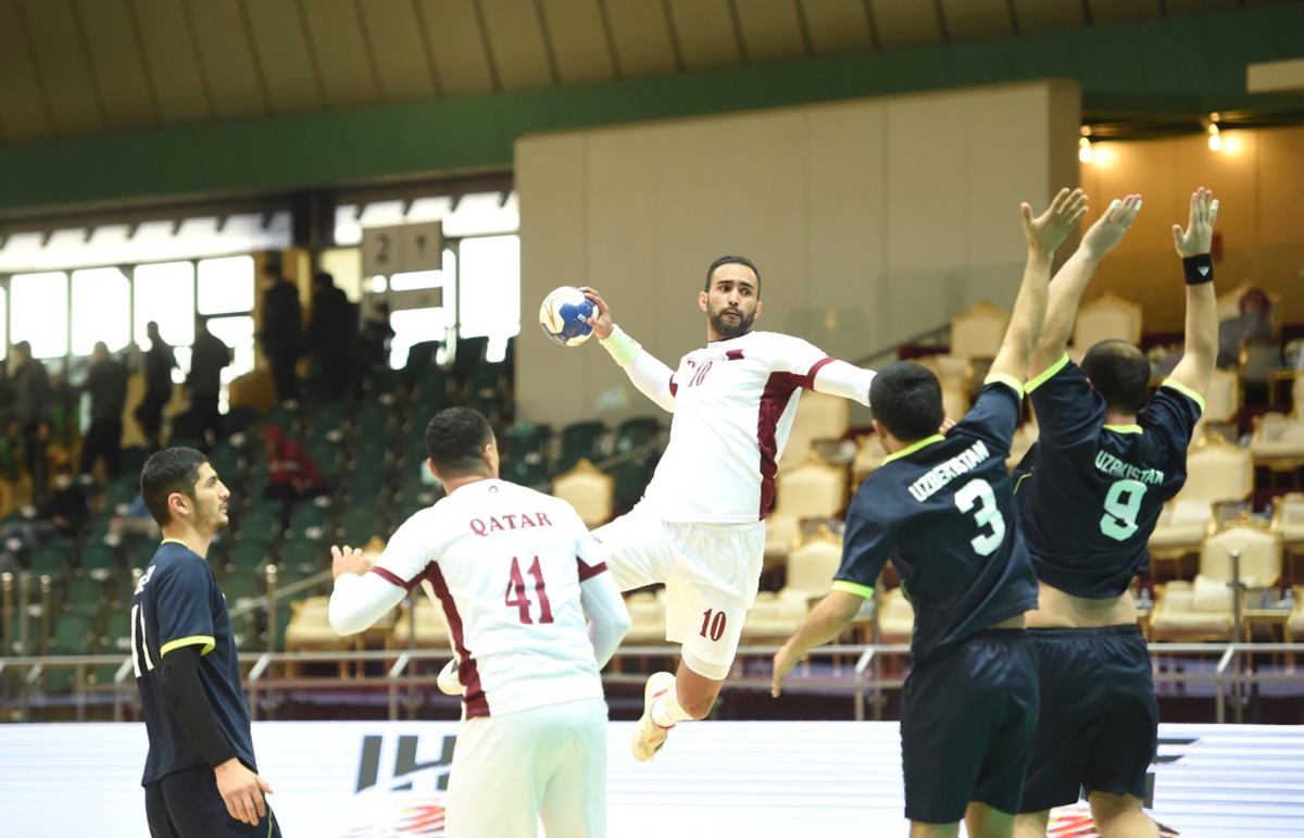 A Qatari player prepares to shoot at the goal during the match against Uzbekistan, yesterday