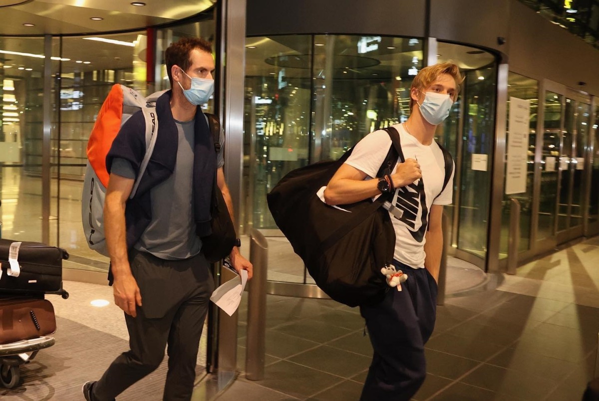 Andy Murray and Denis Shapovalov arrive at the Hamad International Airport ahead of the Qatar ExxonMobil Open.