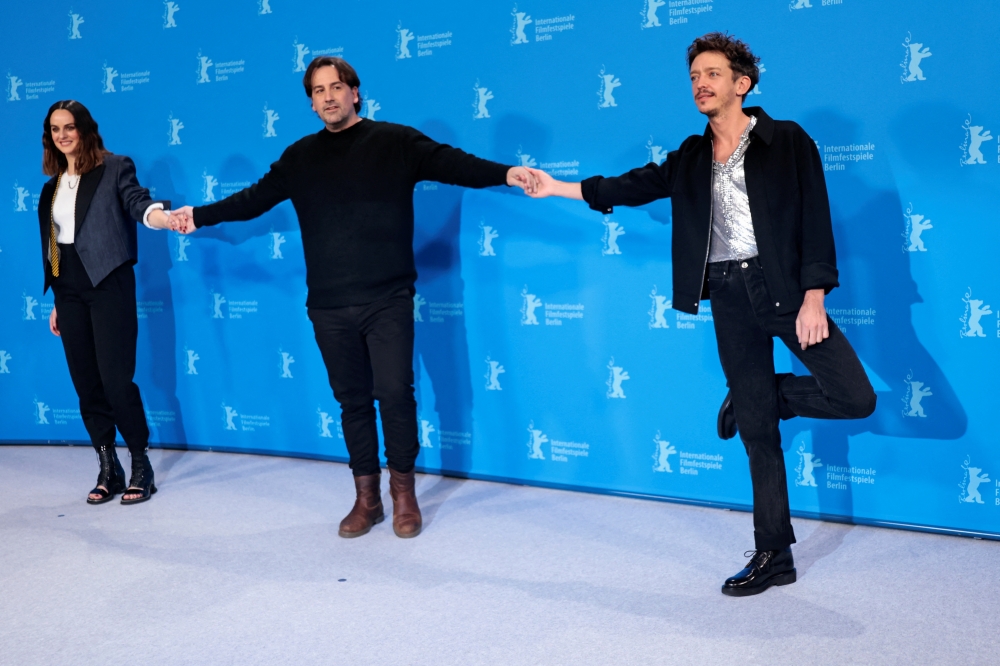 Director Isaki Lacuesta and cast members Noemie Merlant and Nahuel Perez Biscayart attend a photocall to promote the movie 'Un ano, una noche' (One Year, One Night) at the 72nd Berlinale International Film Festival in Berlin, Germany, February 14, 2022. Reuters/Hannibal Hanschke