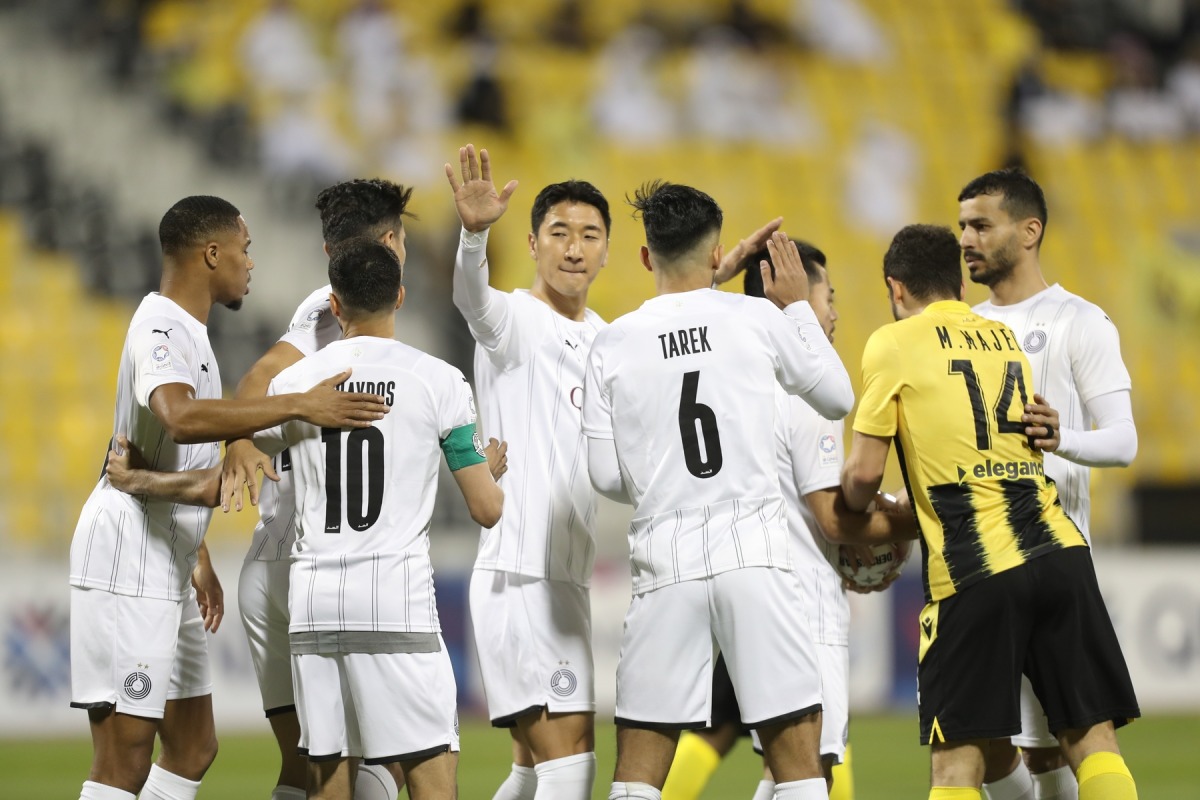 Al Sadd players celebrate after win over Qatar SC in their QSL match yesterday. Al Sadd won the match 1-0 at the Suhaim Bin Hamad Stadium.  PIC: Hussein Sayed 