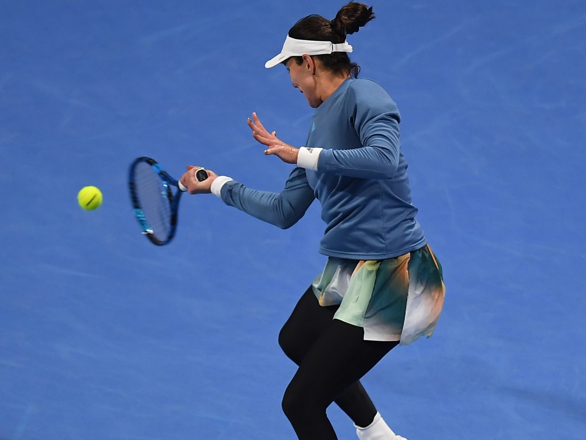 Garbine Muguruza of Spain returns the ball to Sorana Cirstea of Romania during the Qatar TotalEnergies Open yesterday.