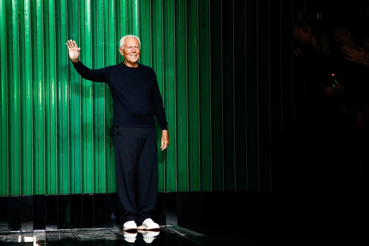 Designer Giorgio Armani appears on the stage after models presented creations from the Giorgio Armani Fall-Winter 2022/2023 collection during Fashion Week in Milan, Italy, February 27, 2022. REUTERS/Alessandro Garofalo
