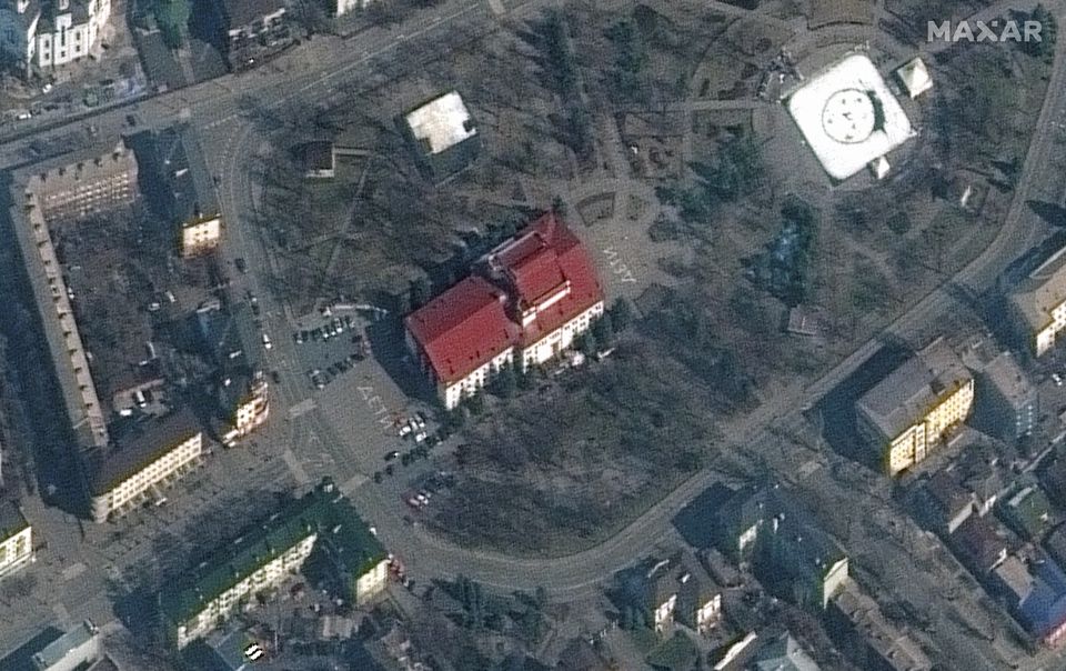 A satellite image shows a closer view of Mariupol Drama Theatre before bombing, as a word 