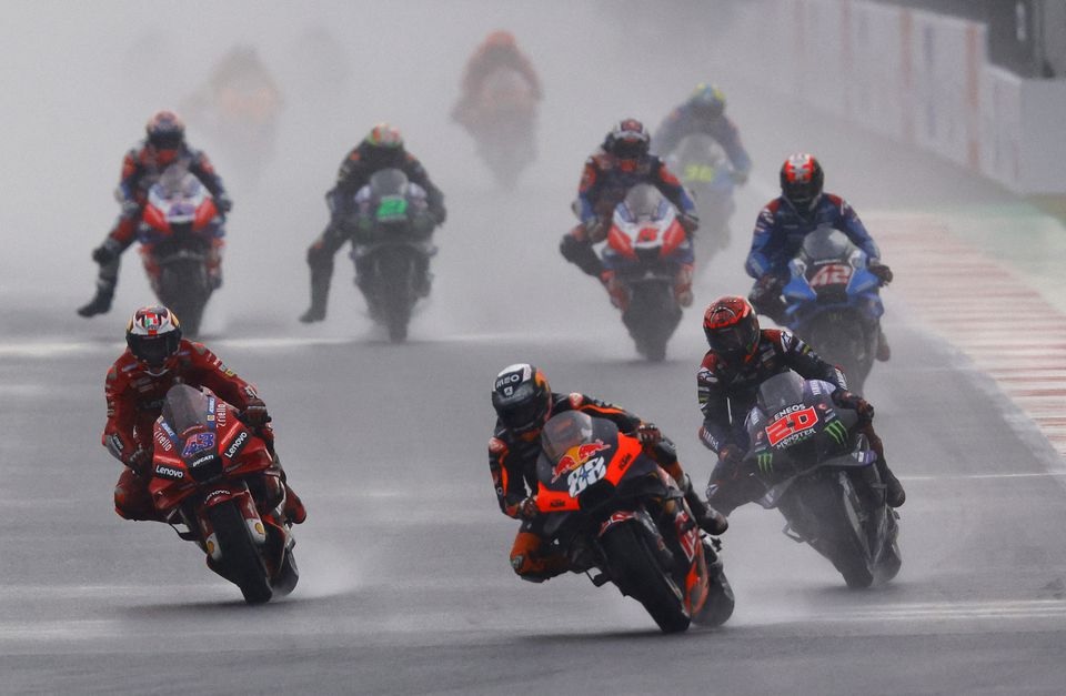 March 20, 2022 Red Bull KTM Factory Racing's Miguel Oliveira in action with Ducati Lenovo's Jack Miller and Monster Energy Yamaha MotoGP's Fabio Quartararo REUTERS/Willy Kurniawan

