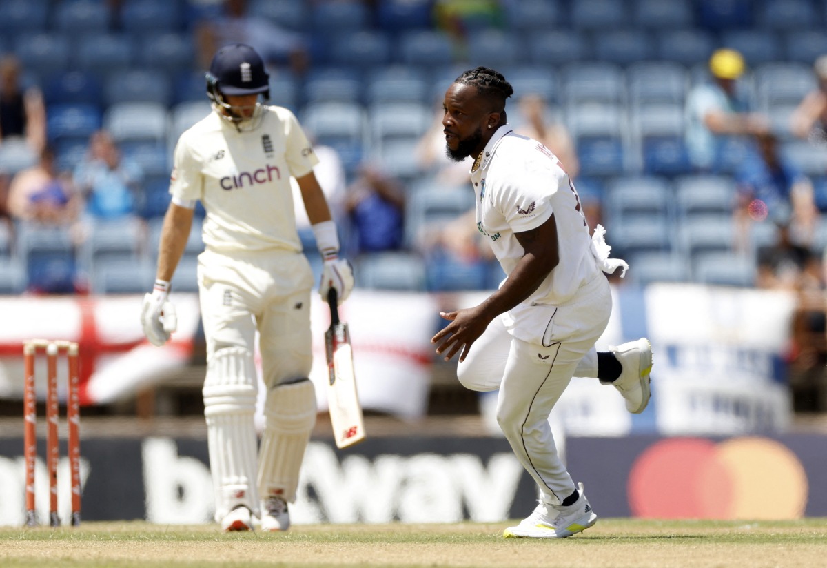 West Indies' Kyle Mayers celebrates after taking the wicket of England's Joe Root Action Images via Reuters/Jason Cairnduff
