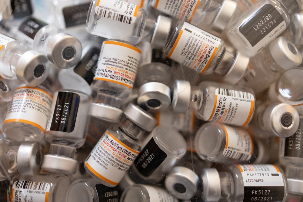 Empty vials of Pfizer-BioNTech COVID-19 vaccine for children over 5 are pictured at Skippack Pharmacy in Schwenksville, Pennsylvania, U.S., May 19, 2022. REUTERS/Hannah Beier/File Phot