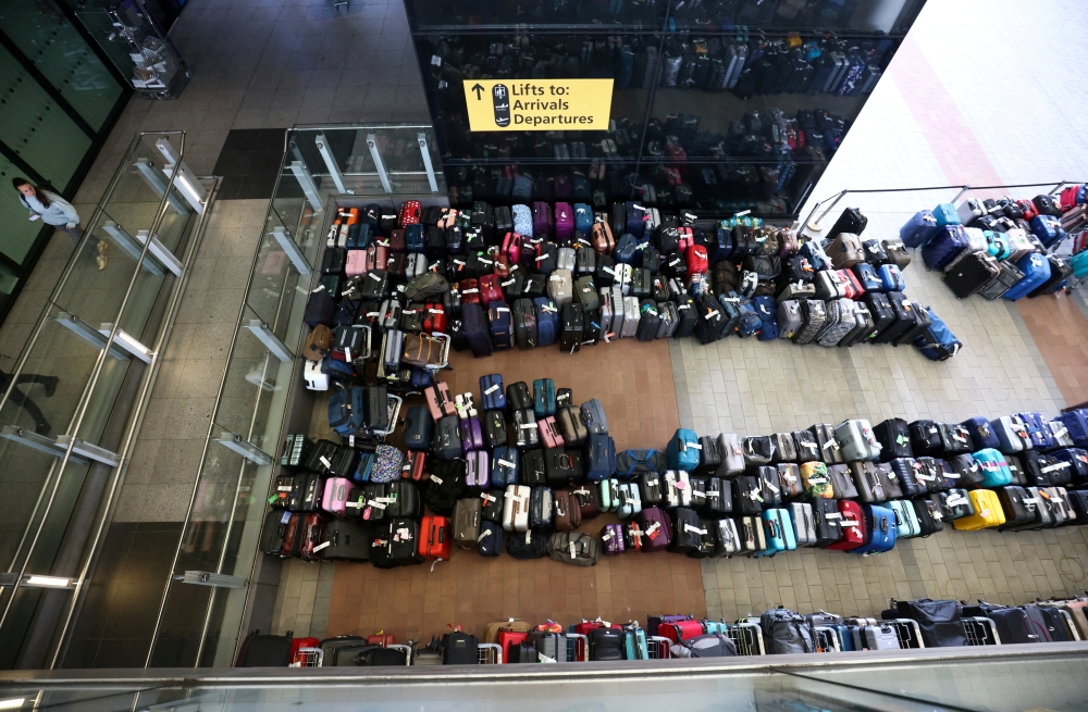 Lines of passenger luggage outside Terminal 2 at Heathrow Airport in London, Britain, recently. (Reuters/Henry Nicholls)