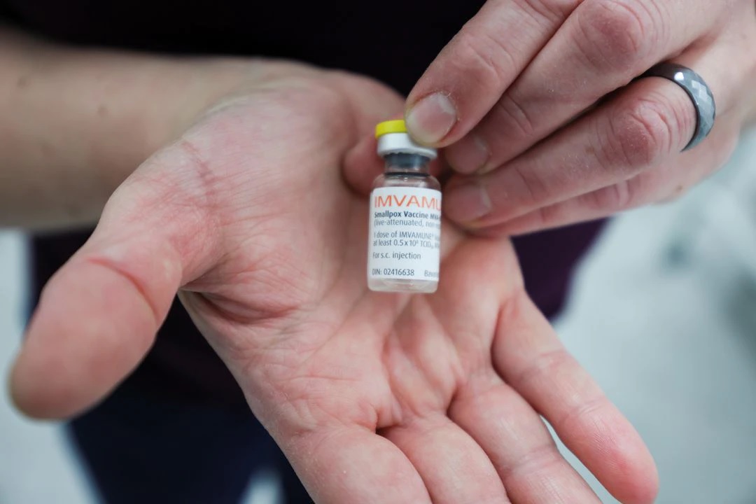 A healthcare worker shows a bottle of the monkeypox vaccine at a clinic run by CIUSSS public health authorities in Montreal, Quebec, Canada, June 6, 2022. REUTERS/Christinne Muschi

