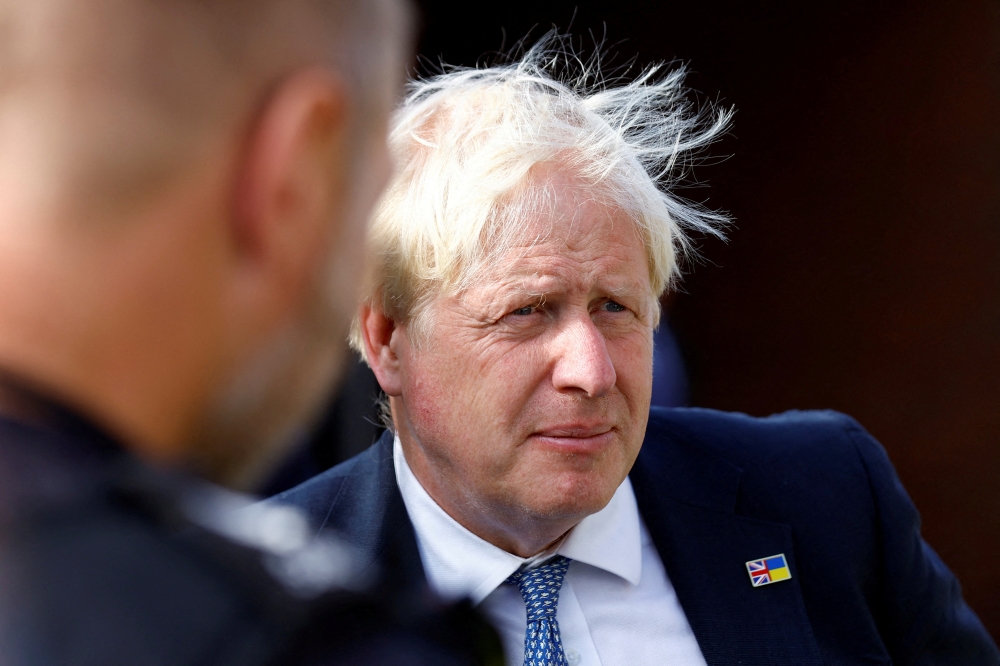 British Prime Minister Boris Johnson looks on during a visit with members of the Thames Valley Police, at Milton Keynes Police Station in Milton Keynes on August 31, 2022. REUTERS/Andrew Boyers/Pool/File Photo