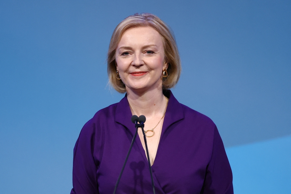 Liz Truss speaks after being announced as Britain's next Prime Minister at The Queen Elizabeth II Centre in London, Britain September 5, 2022. REUTERS/Hannah McKay