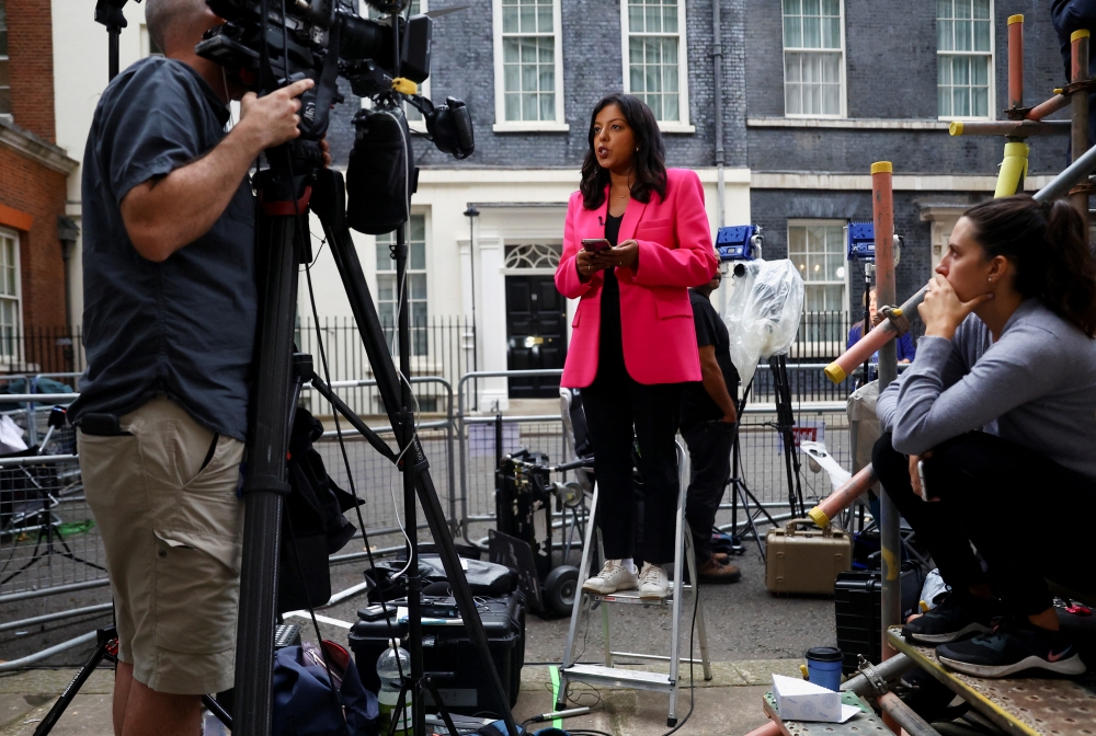 Members of the media work outside 10 Downing Street after Liz Truss was announced as Britain's next Prime Minister, in London, on September 5, 2022. REUTERS/Hannah McKay