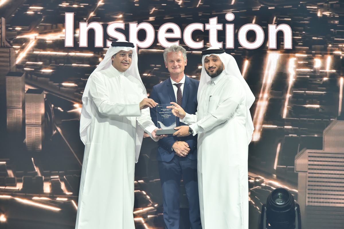 Minister of Communications and Information Technology H E Mohammed bin Ali Al Mannai presents the award to Ali Khaled Al Khulaifi, Director of Planning and Quality Department and Acting Director of Information Technology Department at MoCI, while President of Microsoft EMEA Ralph Haupter looks on, during the ceremony in Doha, recently.  