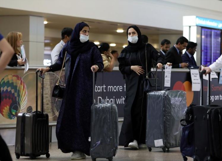 FILE PHOTO: Travellers at the Dubai International Airport, in Dubai, United Arab Emirates January 29, 2020. REUTERS/Christopher Pike
