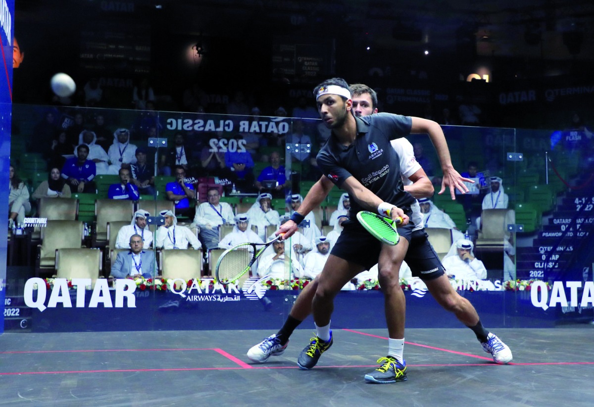 Qatar's Abdulla Mohamed Al Tamimi in action against  England's George Parker during yesterday's match.