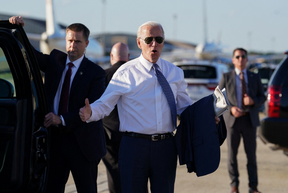 US President Joe Biden reacts to reporters as he departs Washington to vote in the Delaware primary election, from Joint Base Andrews in Maryland, on September 13, 2022. REUTERS/Kevin Lamarque