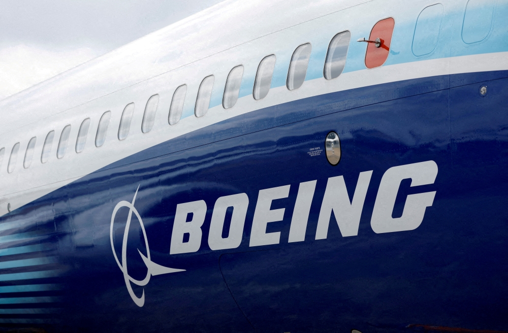 The Boeing logo is seen on the side of a Boeing 737 MAX at the Farnborough International Airshow, in Farnborough, Britain, on July 20, 2022. (REUTERS/Peter Cziborra)