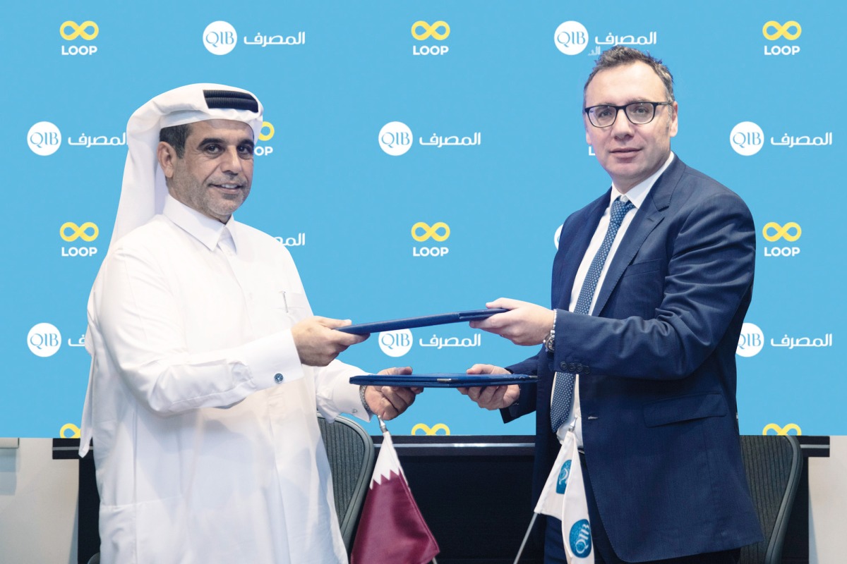 Dinos Constantinides, QIB’s Chief Strategy & Digital Officer and Loop’s Owner Ibrahim Mohd A H Al Mohannadi, during the signing ceremony, recently. 