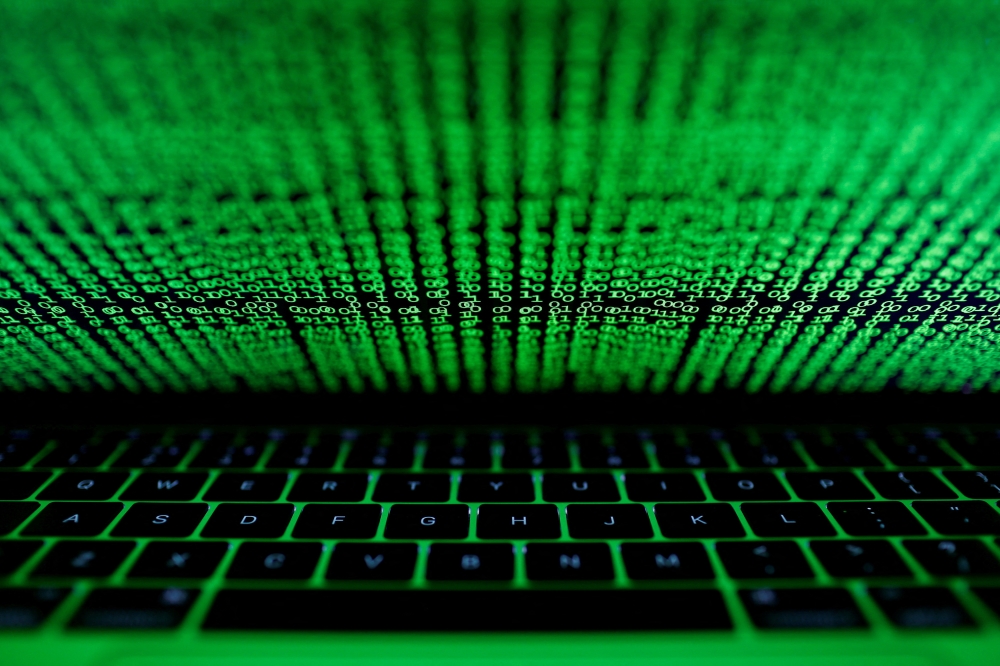 A computer keyboard lit by a displayed cyber code is seen in this illustration picture taken on March 1, 2017. REUTERS/Kacper Pempel/Illustration/File Photo