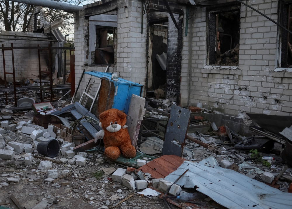 A stuffed toy is seen near a destroyed building in the village of Kamyanka, recently liberated by Ukrainian Armed Forces, in Kharkiv region, Ukraine September 22, 2022. REUTERS/Gleb Garanich